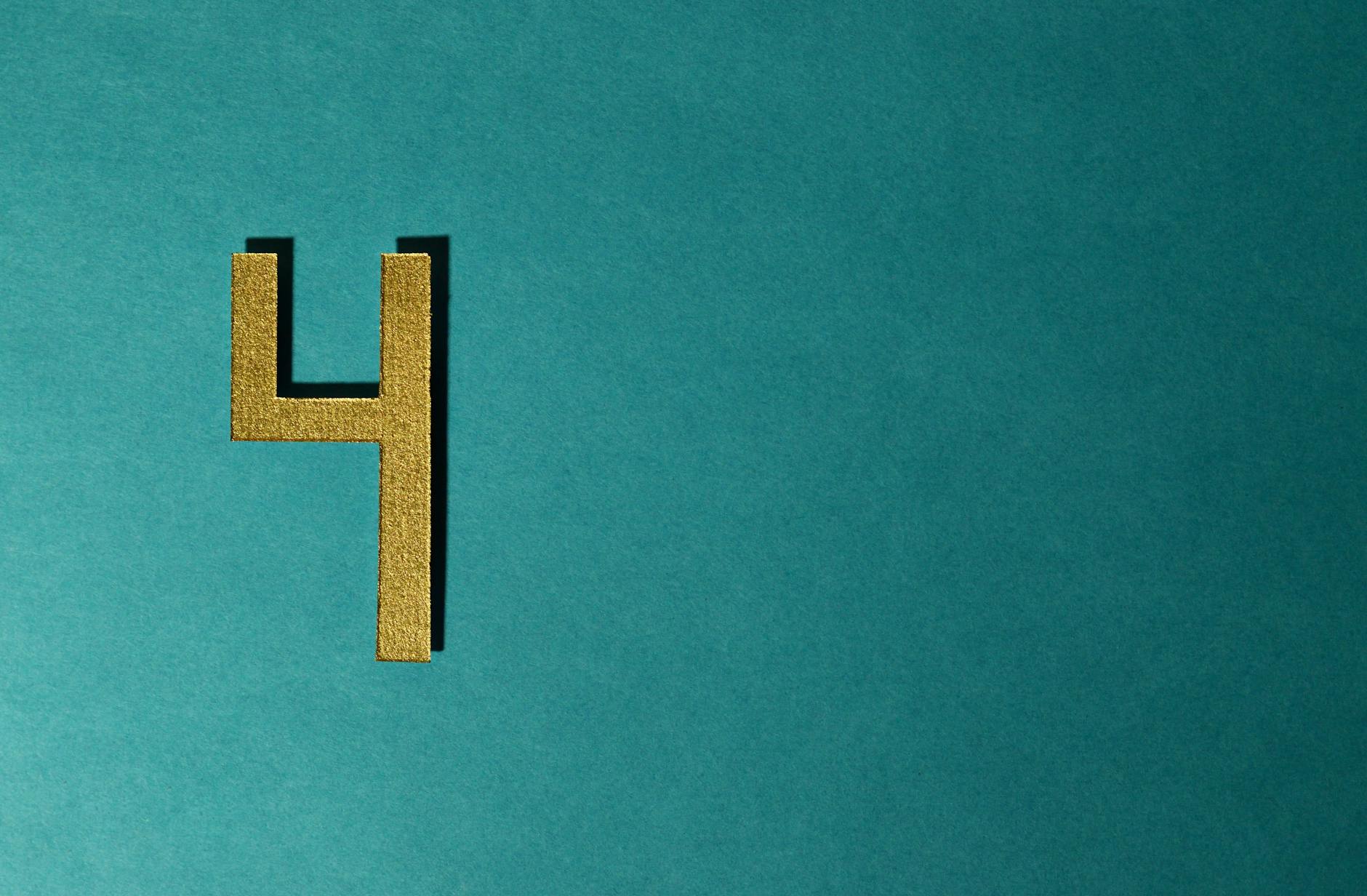 A minimalist still life arrangement of numbers and typography — pricing the cost of disorder.