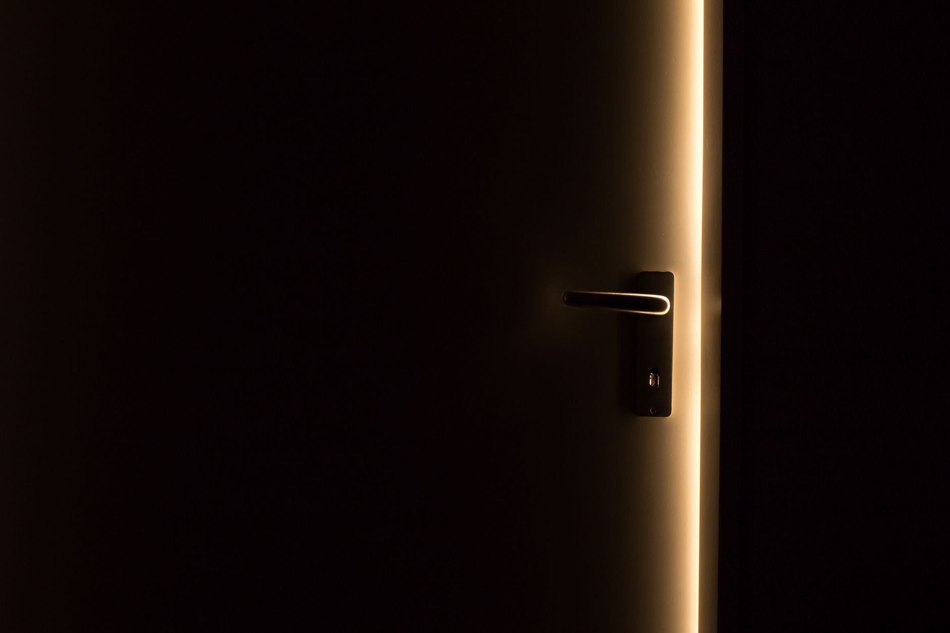 Customer offboarding as a brand moment A door ajar with light beyond it, a metaphor for the customer offboarding brand.