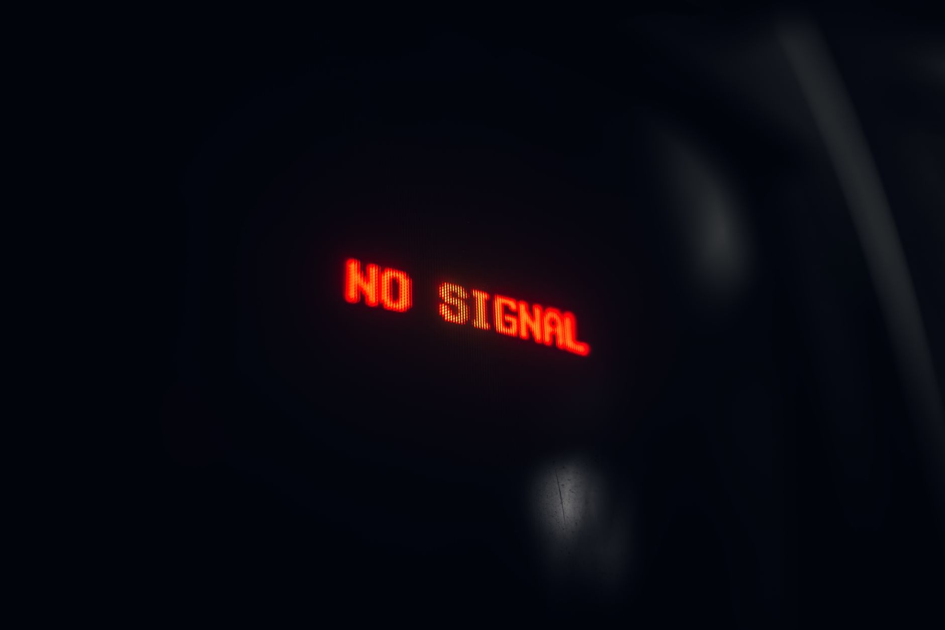 Incident communications as a brand surface A red'No Signal' display in the dark, evoking the incident communications brand.